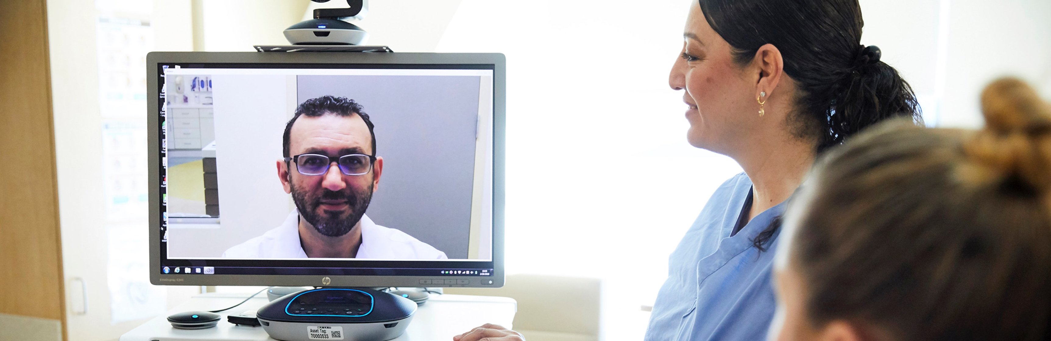 Nurse interacts with a telemedicine robot at the Martin Luther King Junior Community Hospital
