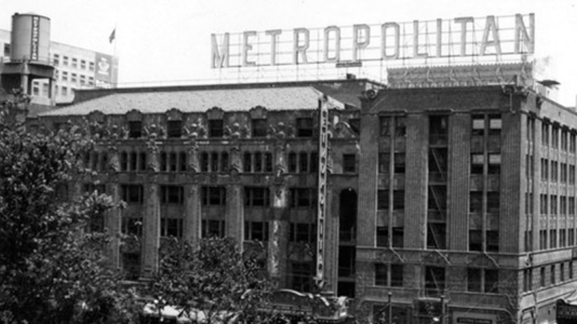 Sepia photo of building with Metropolitan sign